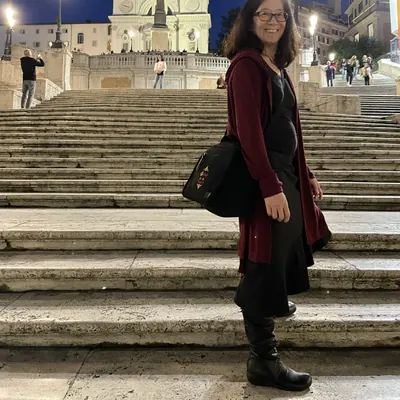 Irene standing on the Spanish Steps at dusk, Rome.